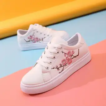 white flower sneakers