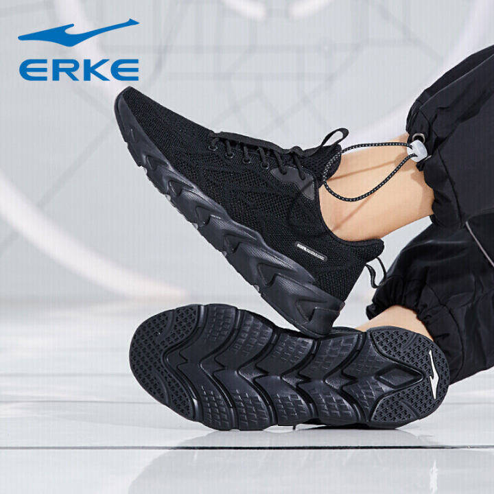 solid black running shoes