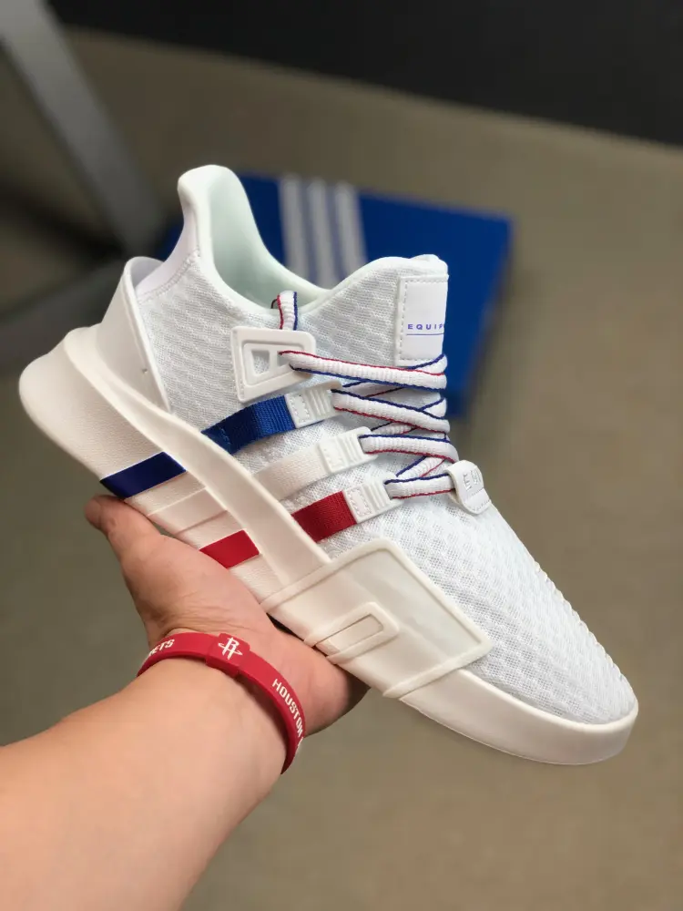 white and red running shoes