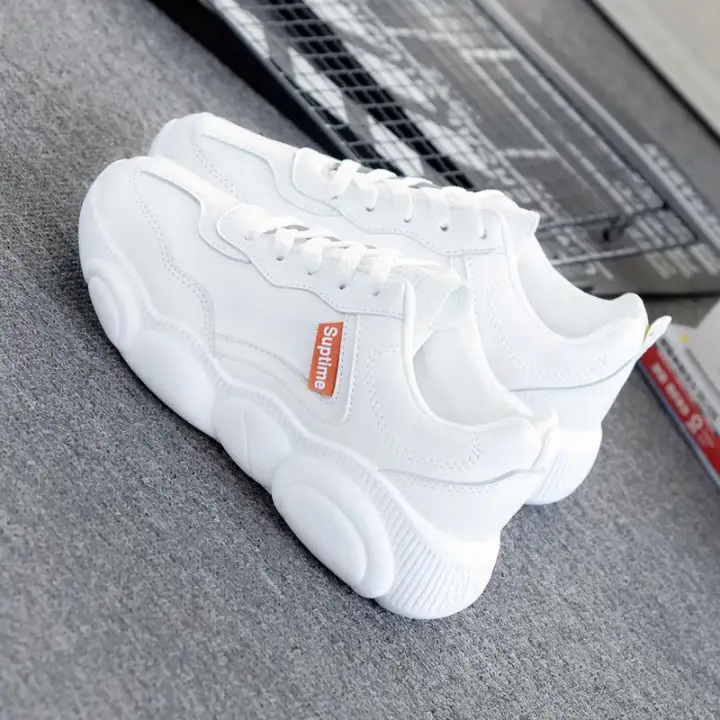 white thick soled tennis shoes