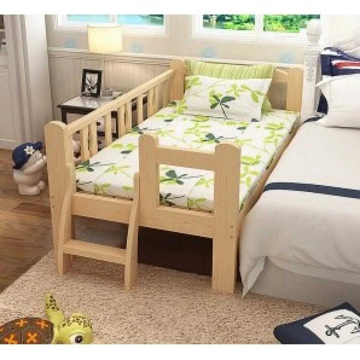 baby cots attached to bed