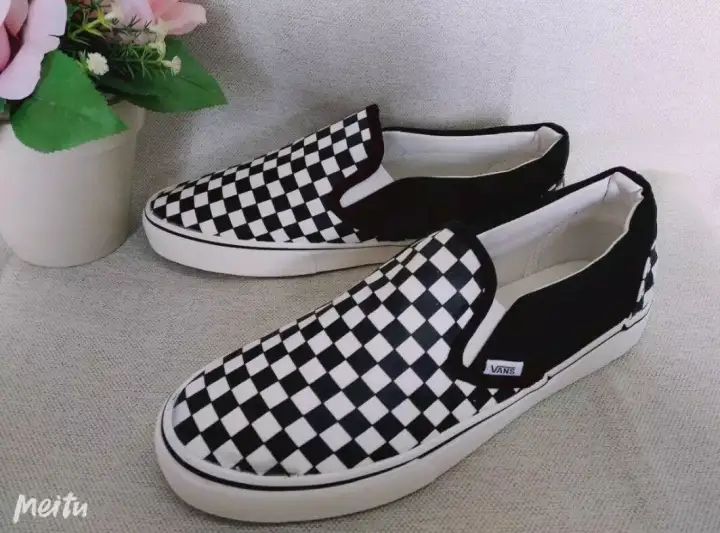 white & black classic slip on spot trainers