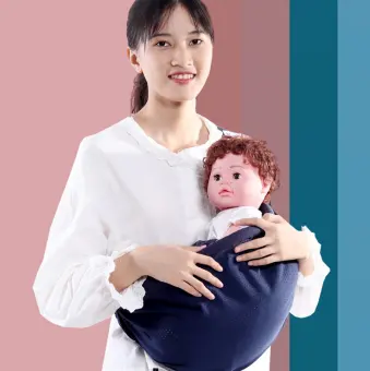 baby holding backpack