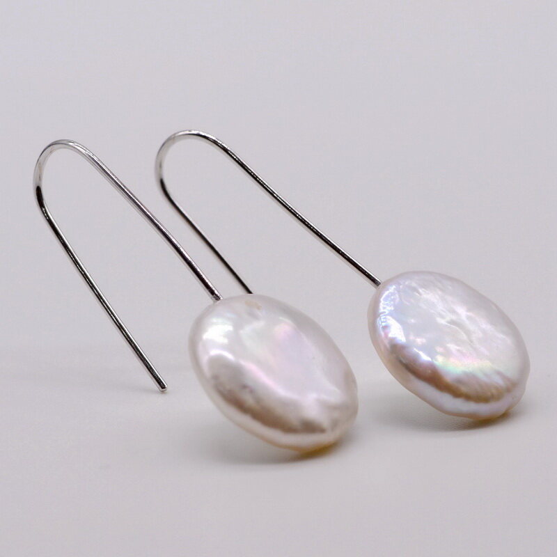 Pearl earrings. Coin shape baroque pearl. White pearl. Accessories in sterling silver. Women's pearl earrings