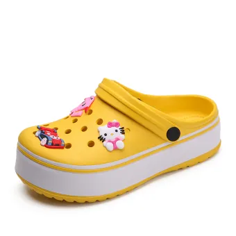 yellow and pink crocs