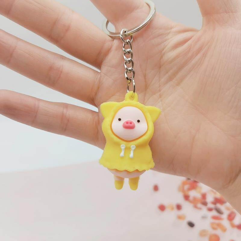Móc khóa hoạt hình dễ thương áo mưa heo búp bê móc khóa ôm heo sữa móc khóa túi mặt dây chuyền