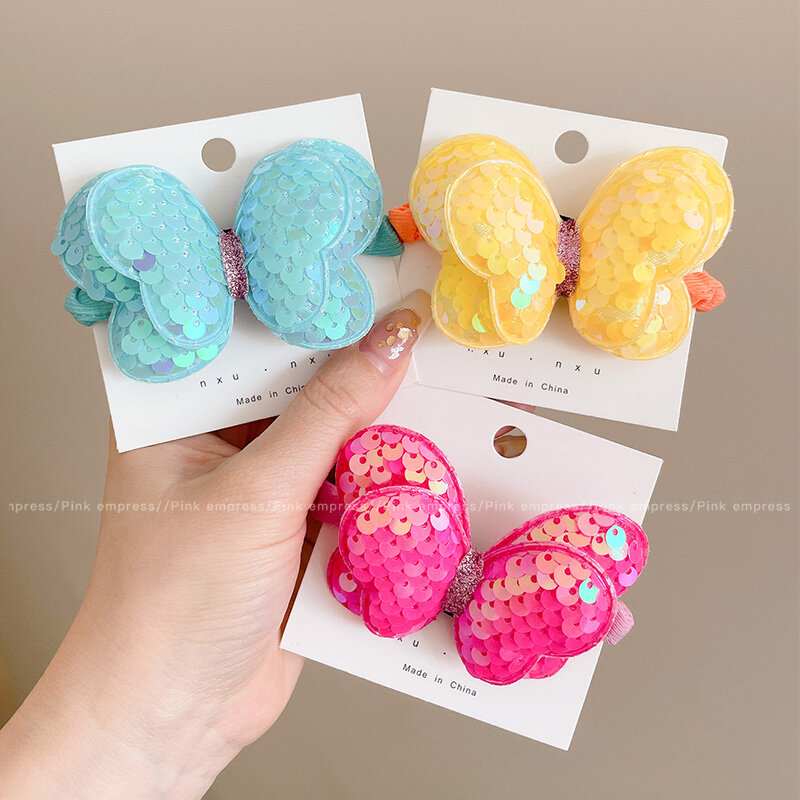 Dây buộc tóc nơ sequin dễ thương cho trẻ em