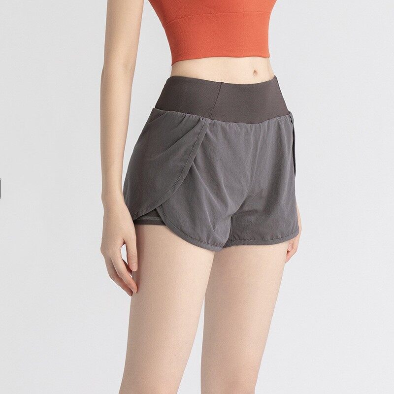 Treningsshorts med elastisk midje og 2 lag til dame, med lomme inni, for yoga, jogging, løping_voghion.com
