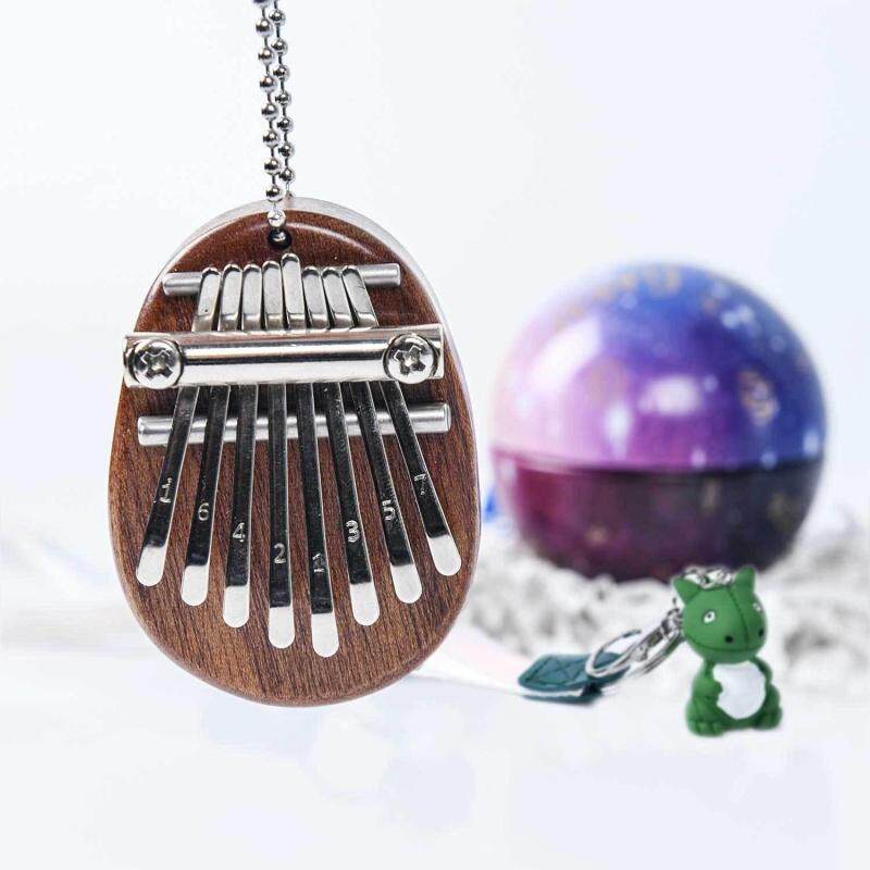 8 Key Kalimba Mini Portable Thumb Piano Finger Percussion Keyboard + Keychain Little Dinosaur Pendant + Colored Spherical Eggs Christmas Present Toy Pendant Set Malaysia