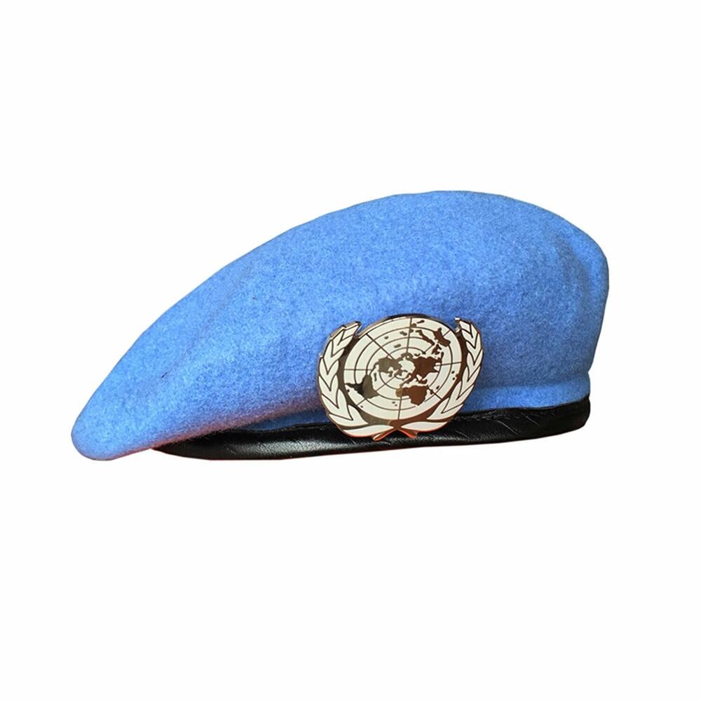 Un blue beret united nations peacekeeping force cap hat with un badge cockade souvenir
