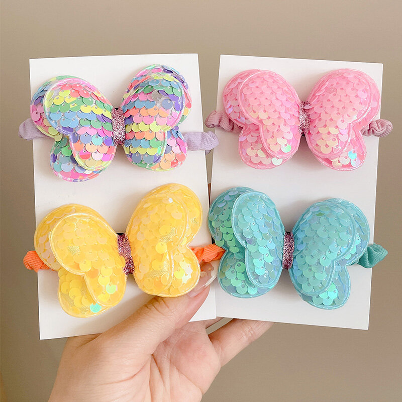 Dây buộc tóc nơ sequin dễ thương cho trẻ em