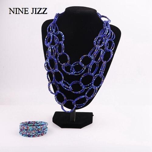 NINEJIZZ Bohemian สร้อยคอแฟชั่นผู้หญิงเครื่องประดับ Handwoven Multi-Layer เมล็ดยาวลูกปัดมีพู่ Choker เซ็ตสร้อยคอ