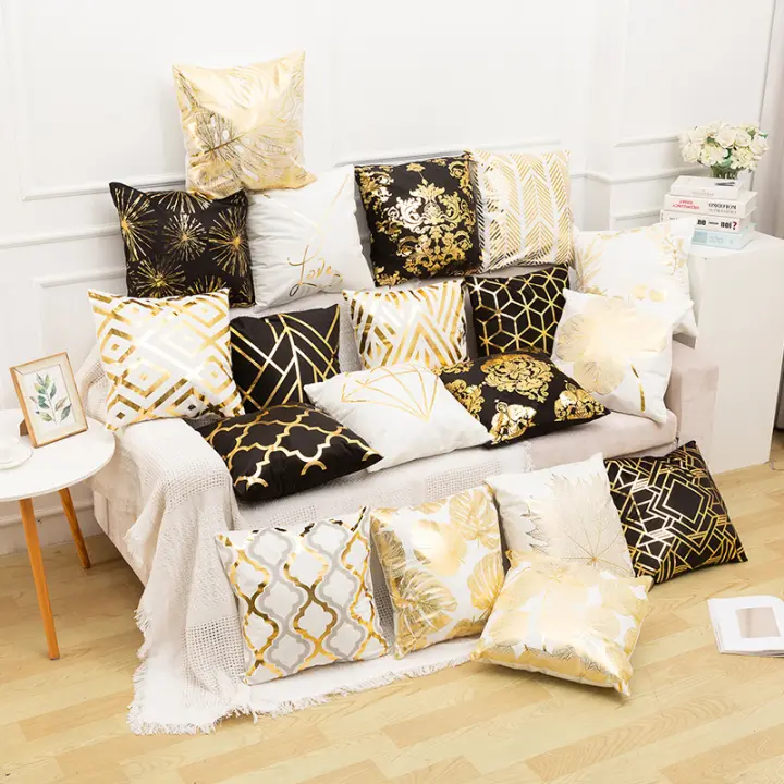 white and gold accent pillows