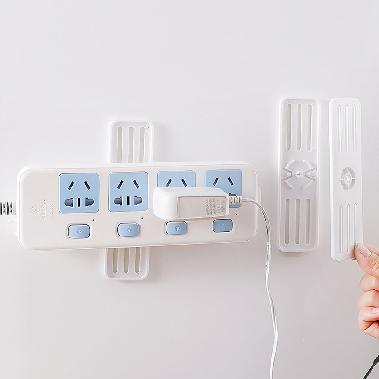 Homenhome 1pcs Self Adhesive Power Strip Hook Power Plug Hanger Wall Mounted Socket Holder