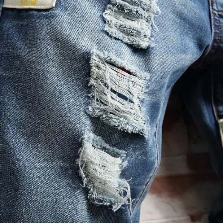 tearing jeans