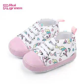 pink and blue baby shoes