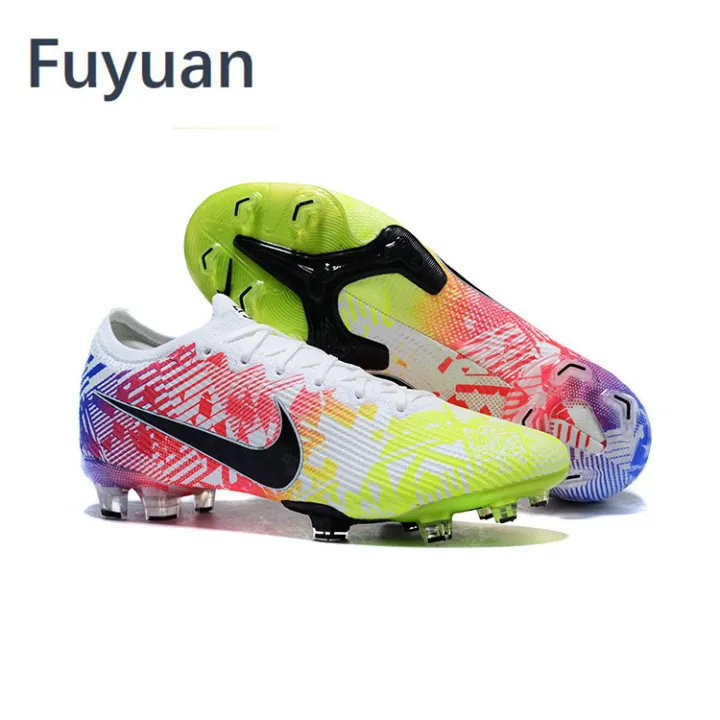 white and green football boots