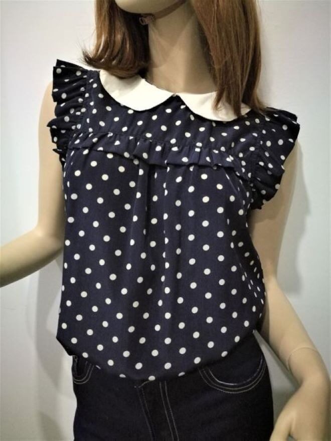 navy blue blouse with white polka dots