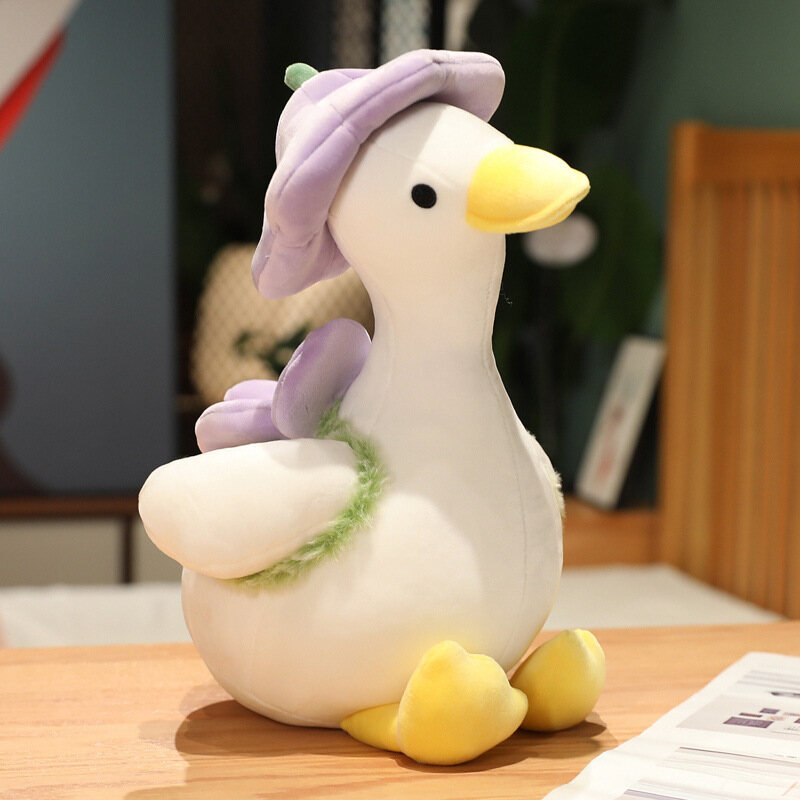 IQANGEL Duck doll with little flower hat and duck plush doll with back flower home decoration goddess gift.