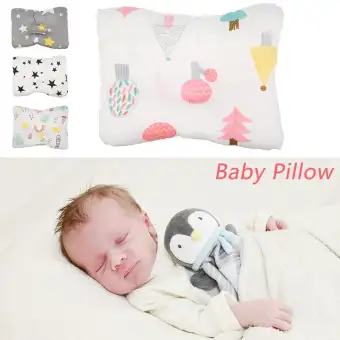 baby sleeping in nursing pillow